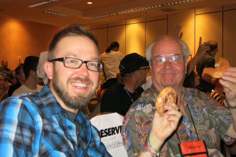 Guru award winner Rocky Montez-Carr and Don Jacob enjoy the traditional Midnight Madness Krispy Kreme donuts
